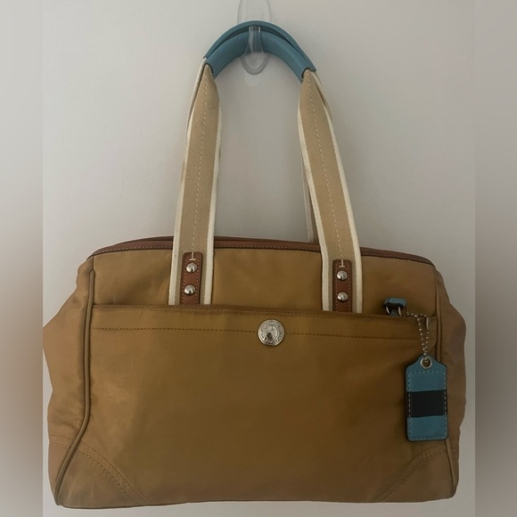 Coach Handbags - COACH 
•Sateen Leather 
•Gold outside 
•Blue interior 
•Satchel Handbag
•F11992